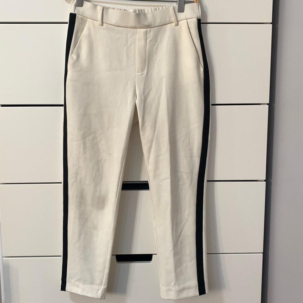White trousers with black side stripe